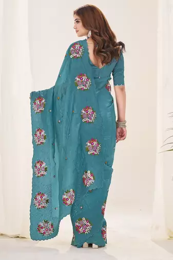 Teal embroidered blouse with embroidered saree