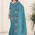 Teal embroidered blouse with embroidered saree