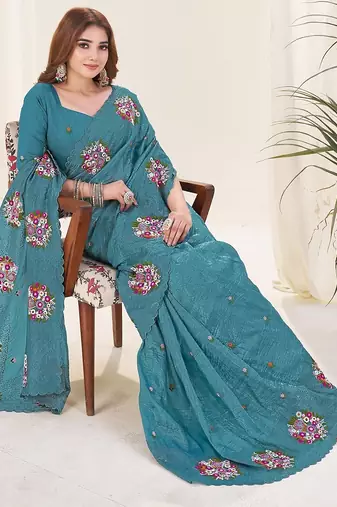 Teal embroidered blouse with embroidered saree