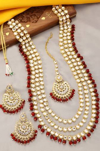 Aheli gold-plated brass and kundan necklace with mang tika & earrings jewellery set