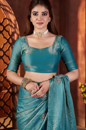 Teal embellished saree with embellished blouse
