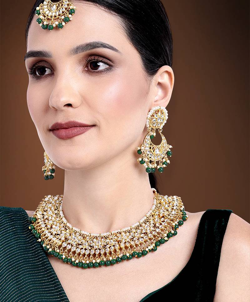 Aheli green kundan choker necklace earrings with maang tikka jewellery set