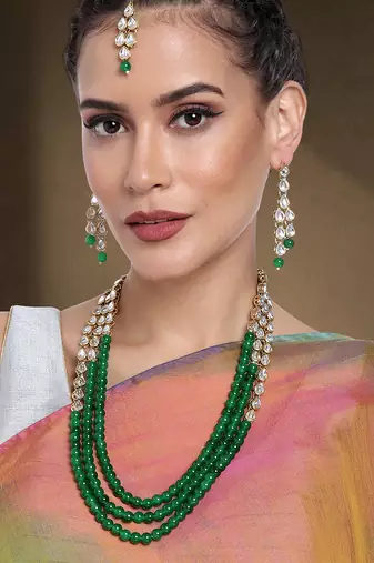 Aheli green traditional jewellery kundan pearl layered necklace earring maang tika set   fancy