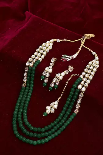 Aheli green traditional jewellery kundan pearl layered necklace earring maang tika set   fancy