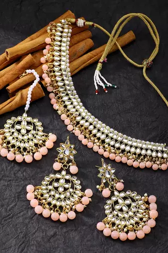Aheli peach kundan pearl choker necklace earring maang tikka traditional jewellery set for women