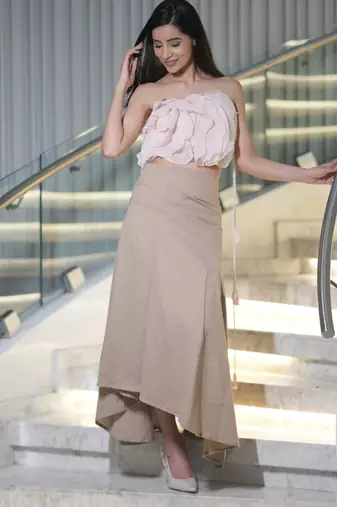 Soft pink ruffled top with pleated linen long skirt