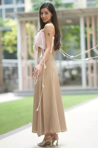 Soft pink ruffled top with pleated linen long skirt