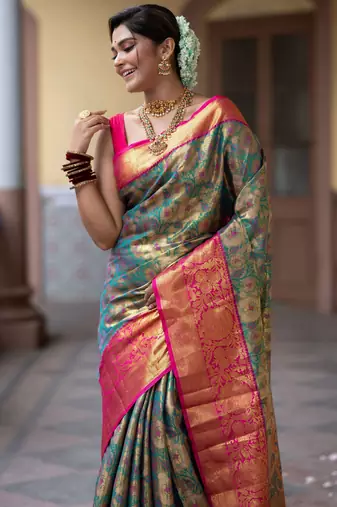 teal green floral, zari work faux kanjivaram semi silk saree with blouse