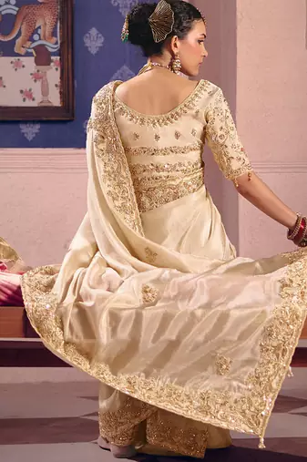 Cream viscose zari tissue silk heavy embroidery, beads with sequince work saree with blouse