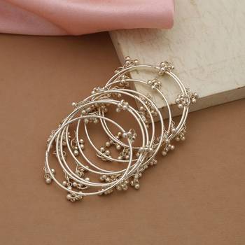 gold alloy bridal bangles with metallic designer work 2
