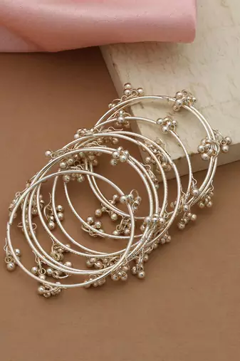 gold alloy bridal bangles with metallic designer work