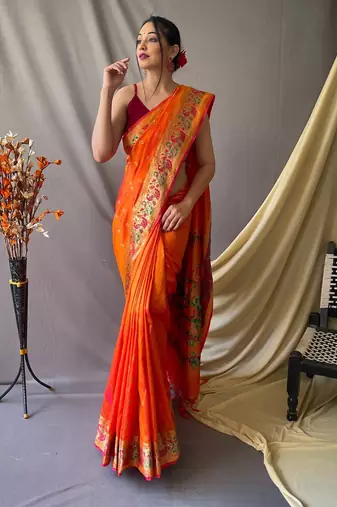 Orange  paithani woven design saree and has a zari border blouse piece