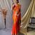 Orange  paithani woven design saree and has a zari border blouse piece