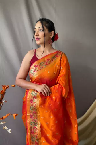 orange paithani saree with traditional woven zari border