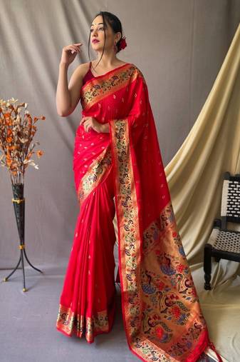 Red  paithani woven design saree and has a zari border blouse piece