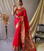 Red  paithani woven design saree and has a zari border blouse piece