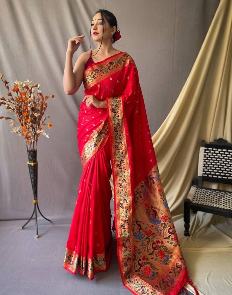 Red  paithani woven design saree and has a zari border blouse piece