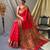Red  paithani woven design saree and has a zari border blouse piece