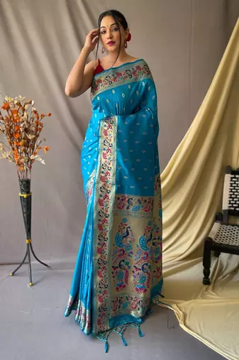 Sky blue  paithani woven design saree and has a zari border blouse piece