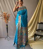 Sky blue  paithani woven design saree and has a zari border blouse piece