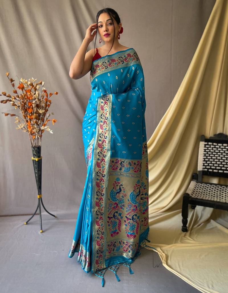 Sky blue  paithani woven design saree and has a zari border blouse piece