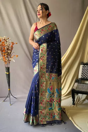 Navy blue  paithani woven design saree and has a zari border blouse piece