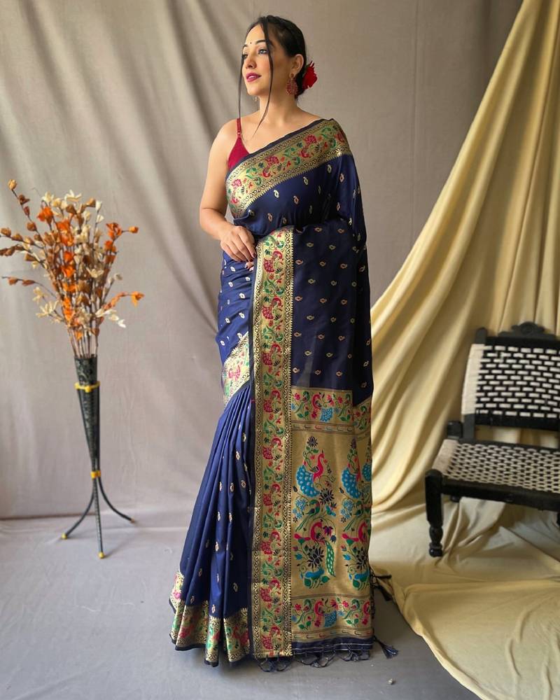 Navy blue  paithani woven design saree and has a zari border blouse piece