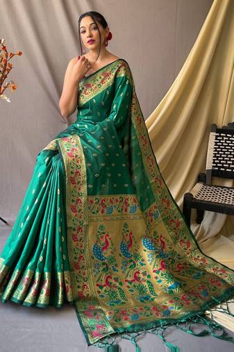 Green  paithani woven design saree and has a zari border blouse piece