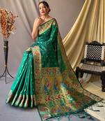 Green  paithani woven design saree and has a zari border blouse piece