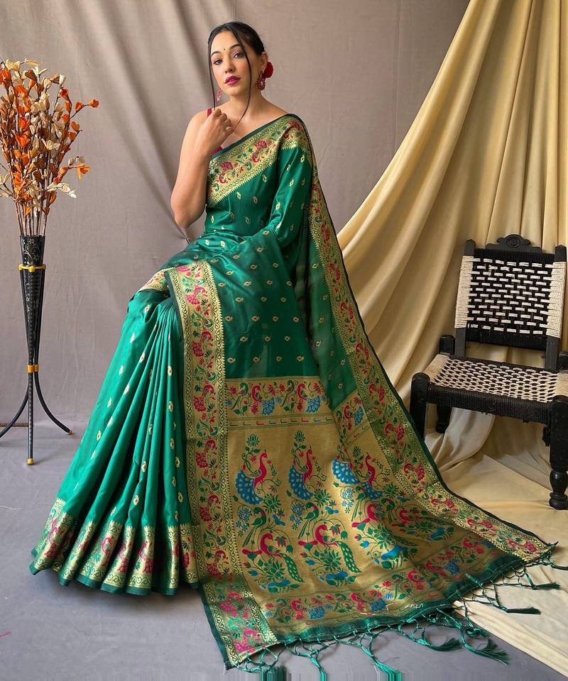 Green  paithani woven design saree and has a zari border blouse piece