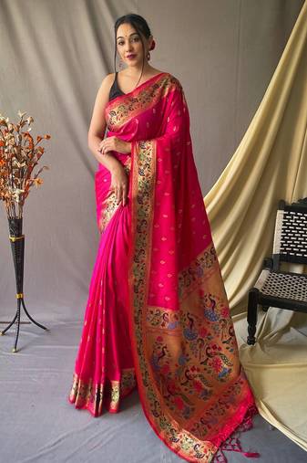 Pink paithani woven design saree and has a zari border blouse piece