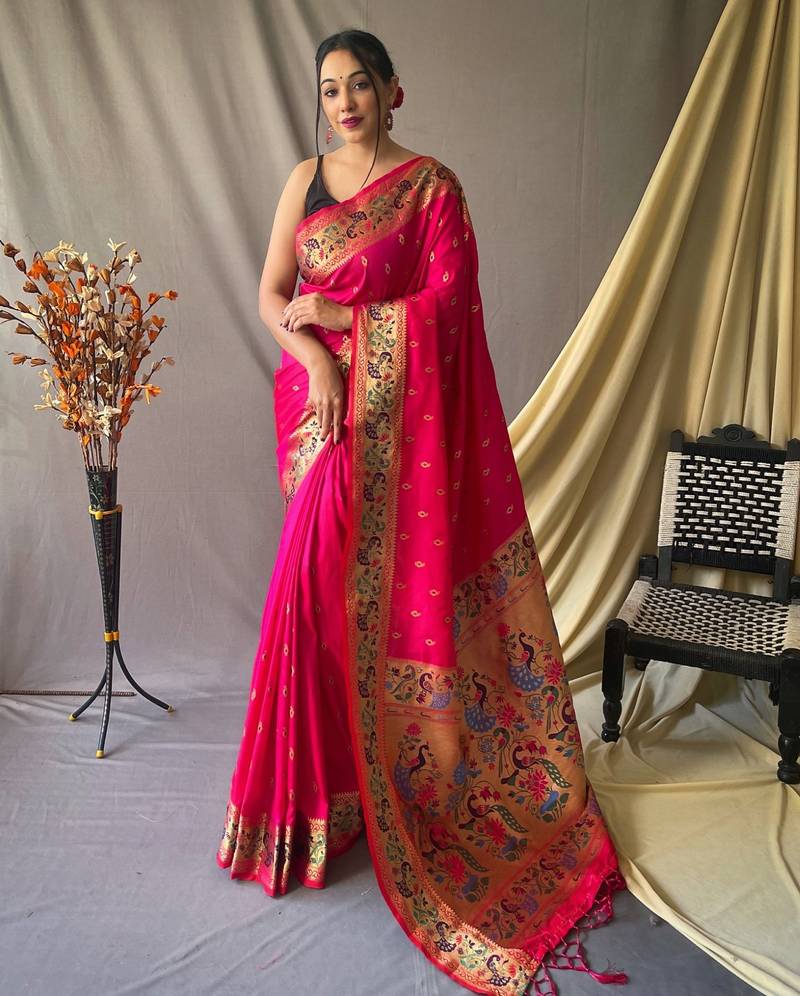 Pink paithani woven design saree and has a zari border blouse piece