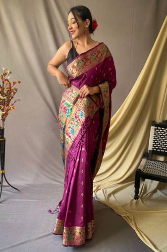 Purple paithani woven design saree and has a zari border blouse piece