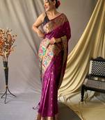 Purple paithani woven design saree and has a zari border blouse piece