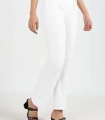 Women solid white regular fit mid-rise flat front trousers
