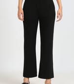 Women solid black regular fit mid-rise flat front trousers