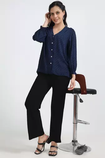women solid black regular fit mid-rise flat front trousers