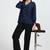 Women solid black regular fit mid-rise flat front trousers