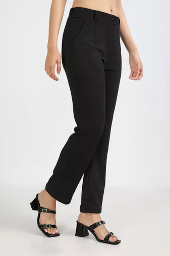 women solid black regular fit mid-rise flat front trousers