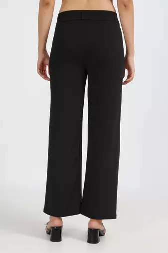 women solid black regular fit mid-rise flat front trousers