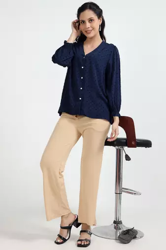 women solid beige regular fit mid-rise flat front trousers