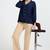Women solid beige regular fit mid-rise flat front trousers