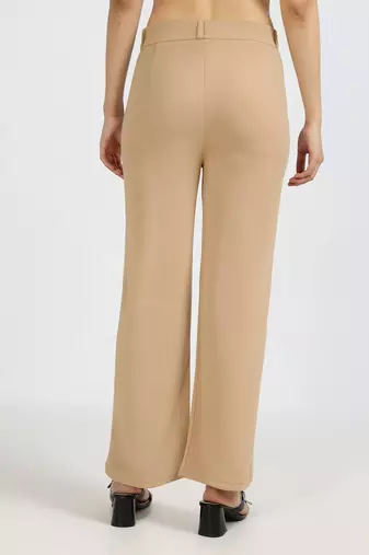 women solid beige regular fit mid-rise flat front trousers