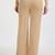 Women solid beige regular fit mid-rise flat front trousers