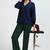 Women solid green regular fit mid-rise flat front trousers