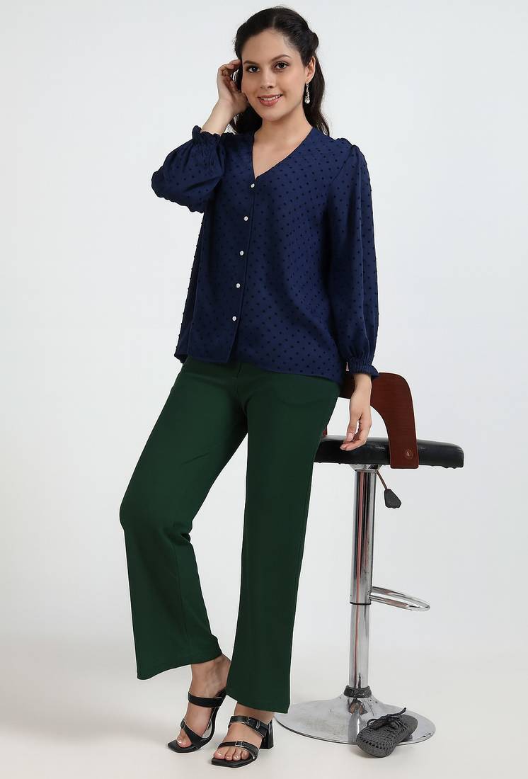 Women solid green regular fit mid-rise flat front trousers
