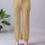 Women solid beige regular fit mid-rise flat front trousers