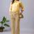 Women solid beige regular fit mid-rise flat front trousers