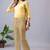 Women solid beige regular fit mid-rise flat front trousers