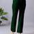 Women solid green regular fit mid-rise flat front trousers